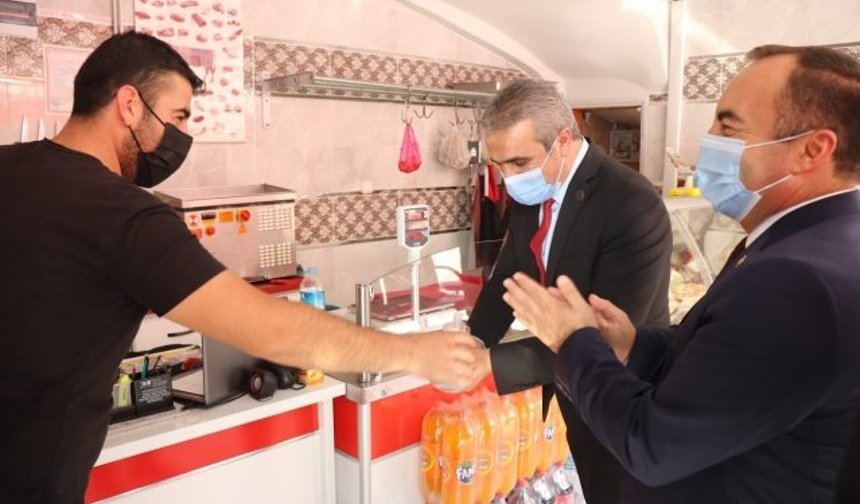 MHP’den esnafa destek ziyareti